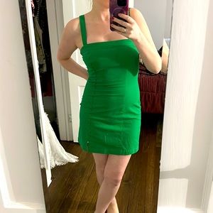 Green form fitting mini dress